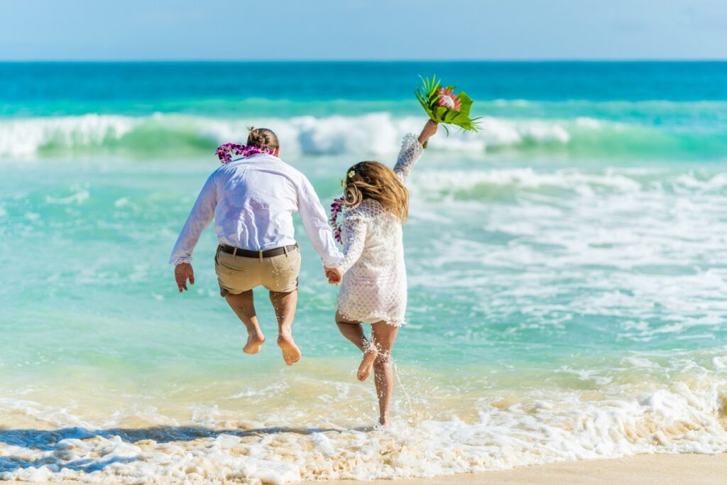 couple celebrating their beach destination wedding