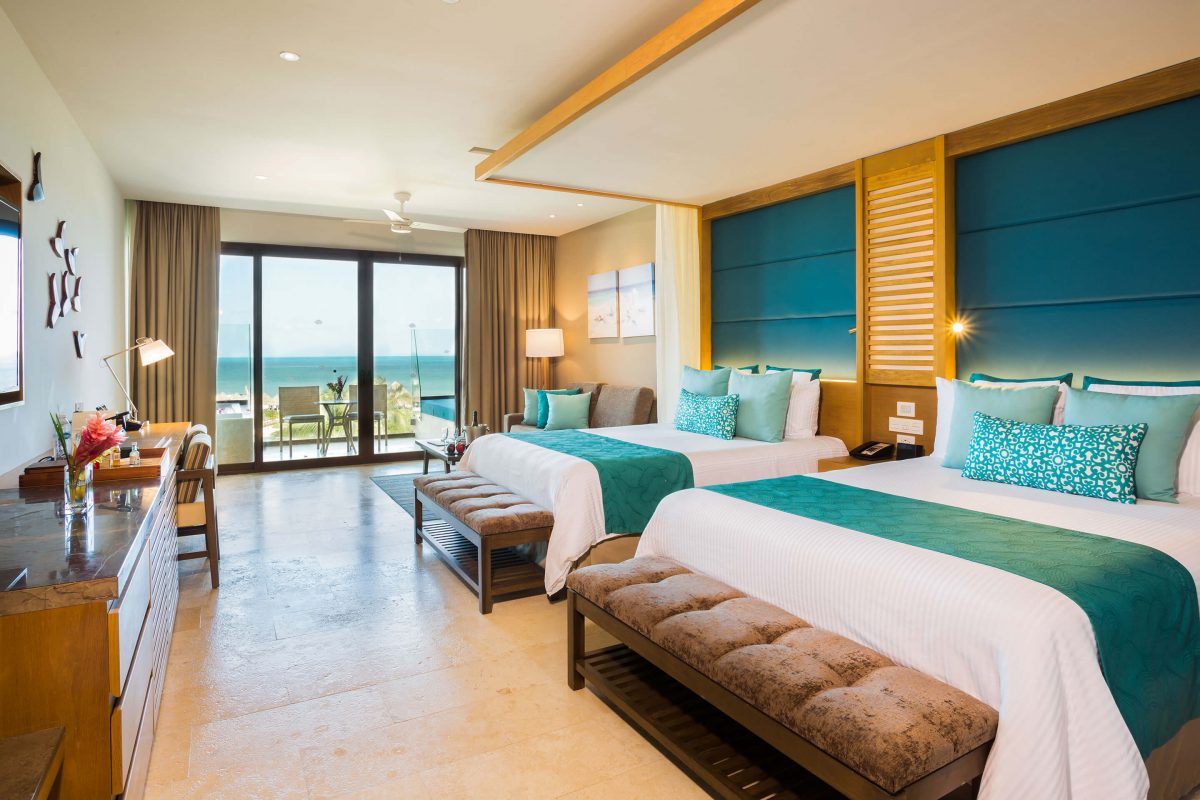 room with two double beds in the preferred club section at the Dreams Playa Mujeres