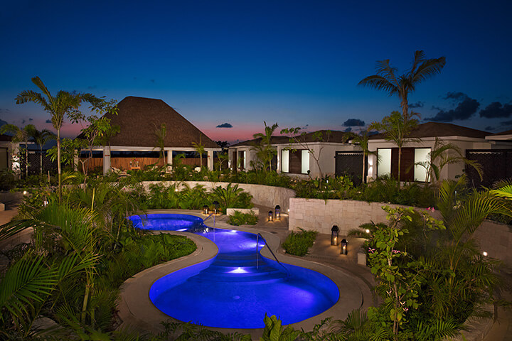 view of the pool at night Dreams Playa Mujeres