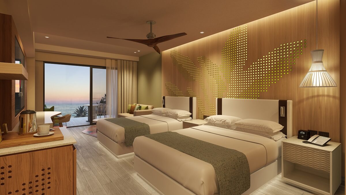 the junior suite at hyatt ziva cap cana featuring two double beds and ocean view