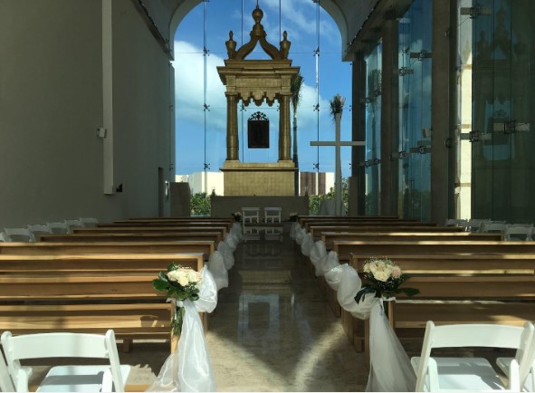 interior of the catholic chapel for weddings at palladium costa mujeres