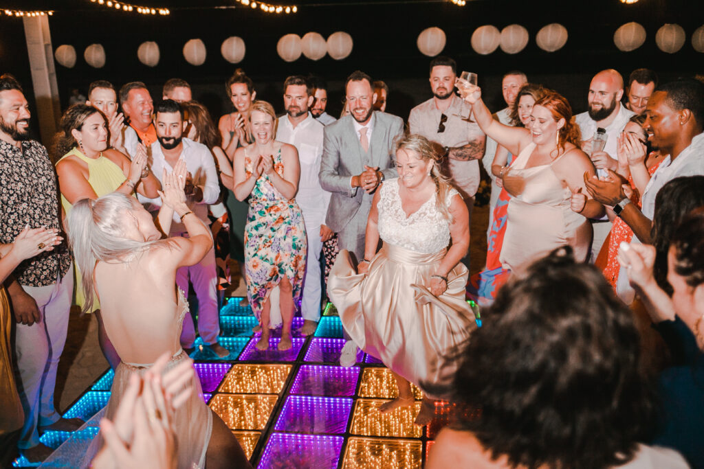 a wedding party group having a great time on the dance floor