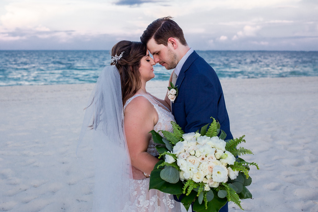 Just married couple kissing on the beach