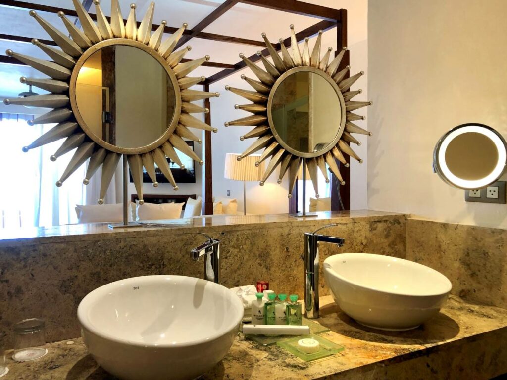 Suite bathroom with double vanities and bulgari amenities