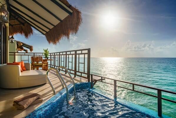 room balcony with plunge pool, lounger and ocean view at palafitos mexico