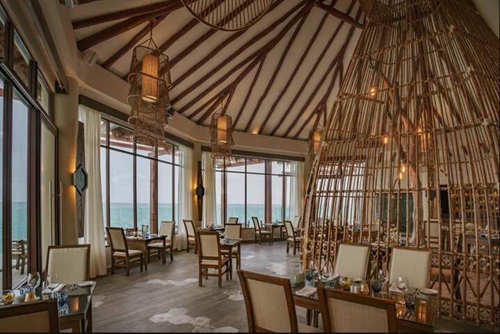 ocean view restaurant interior with dome room and bamboo decor