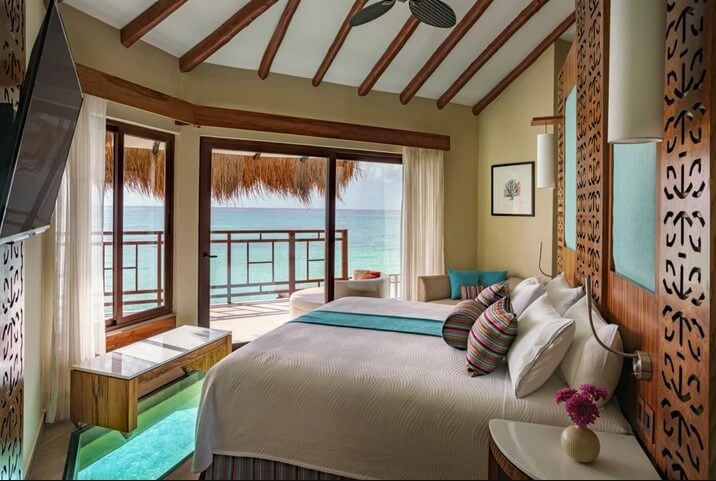 hotel room interior with ocean views at palafitos over the water bungalows in riviera maya