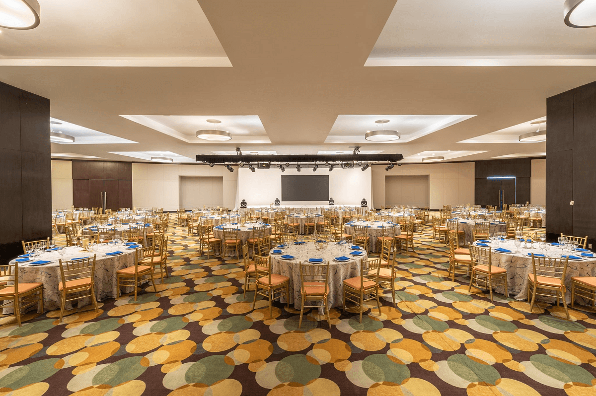 Banquet service with golden chairs in ballroom
