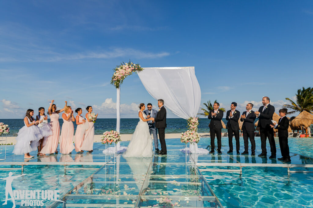 Over the water wedding with bridesmaids and groomsmen