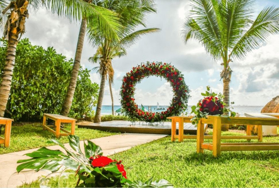 Garden terrace for weddings with a red rose arch