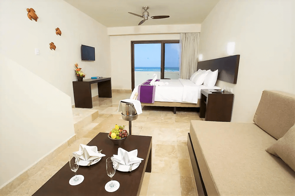 Hotel suite with king size bed and ocean view