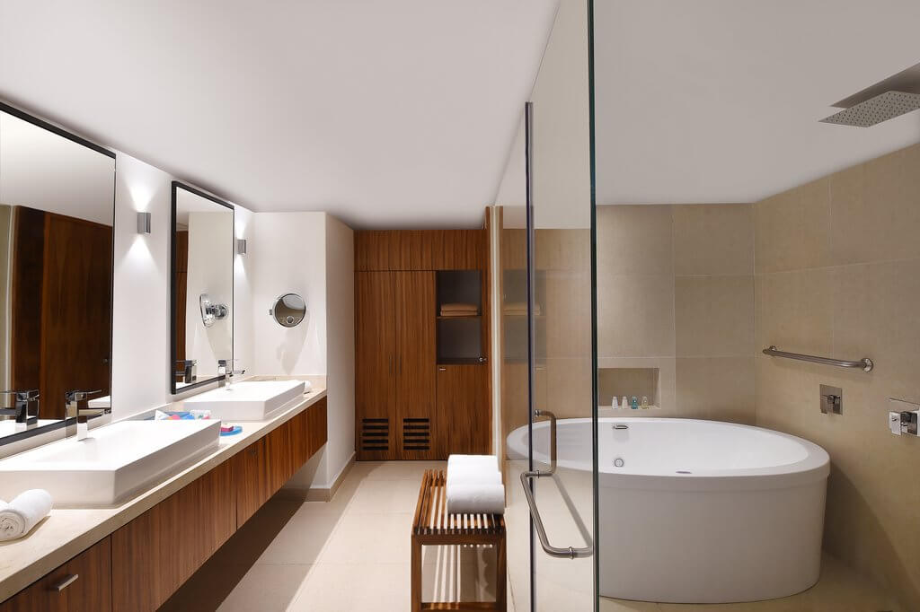 Bathroom with a large bathtub and double vanities