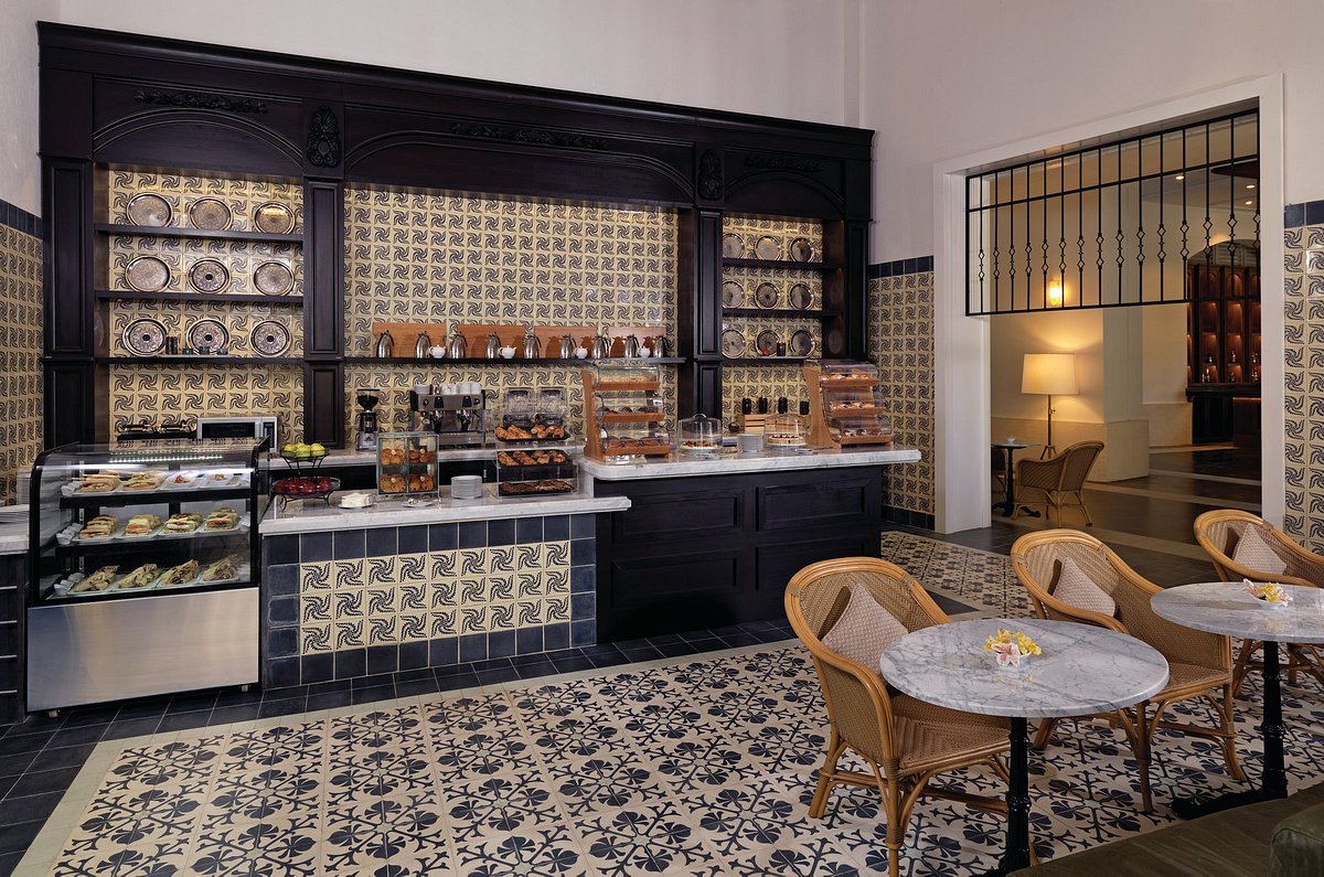 deli cafe with decorated tiles and marble tables