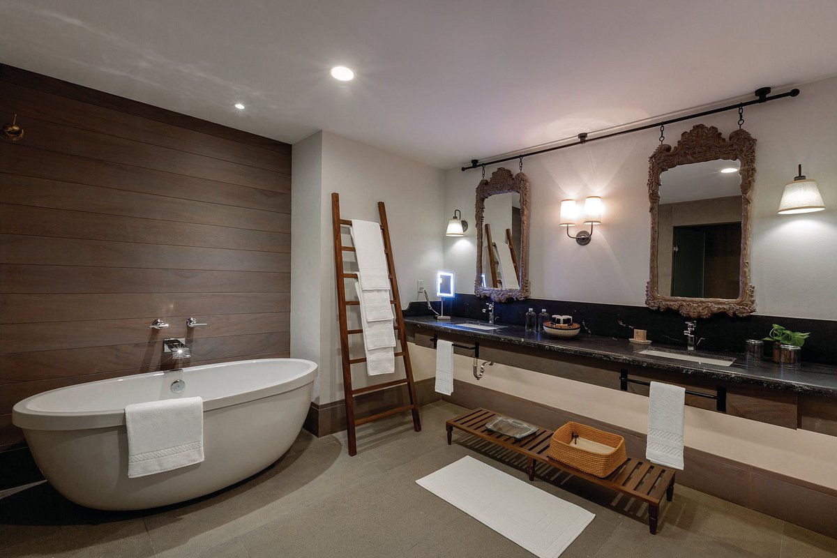 Hotel bathroom with double vanities and bathtub