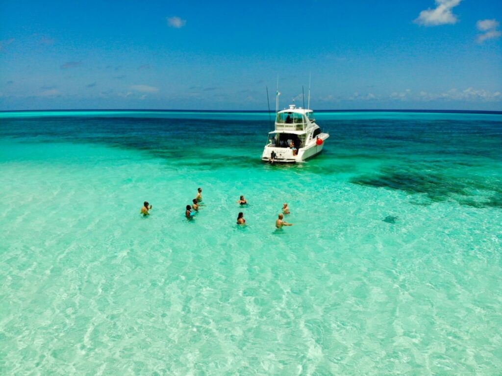 Snorkel tour by boat to a clear shallow beach