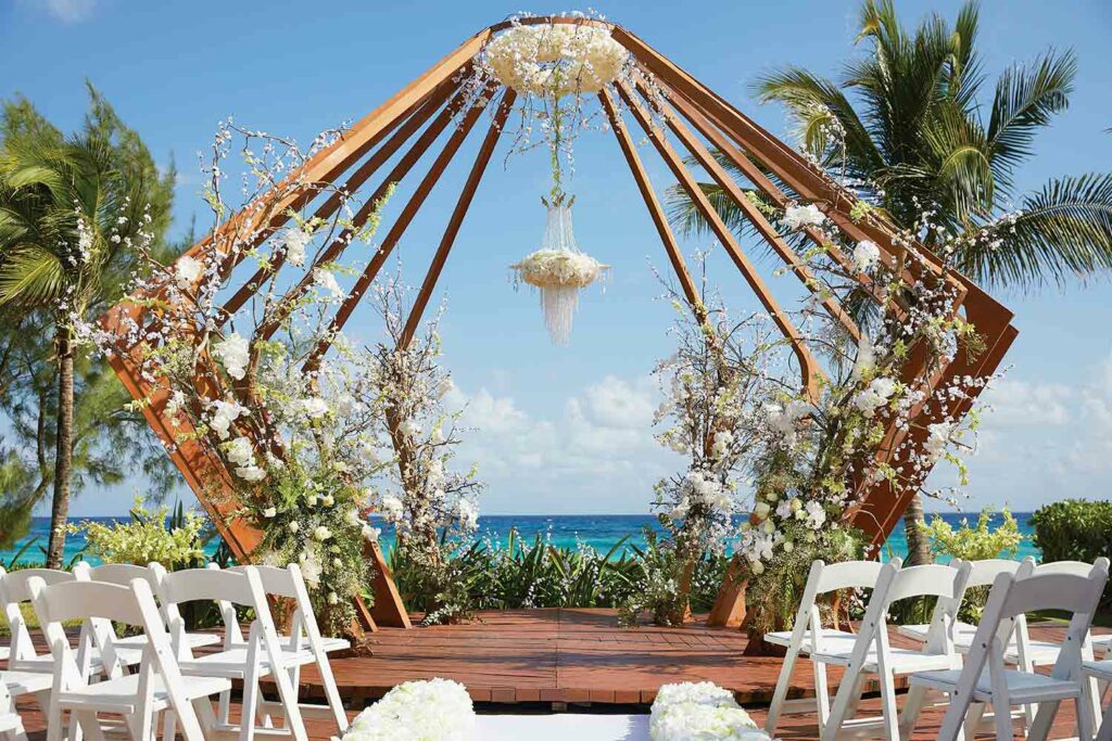 Wedding oceanfront gazebo with lots of white flowers