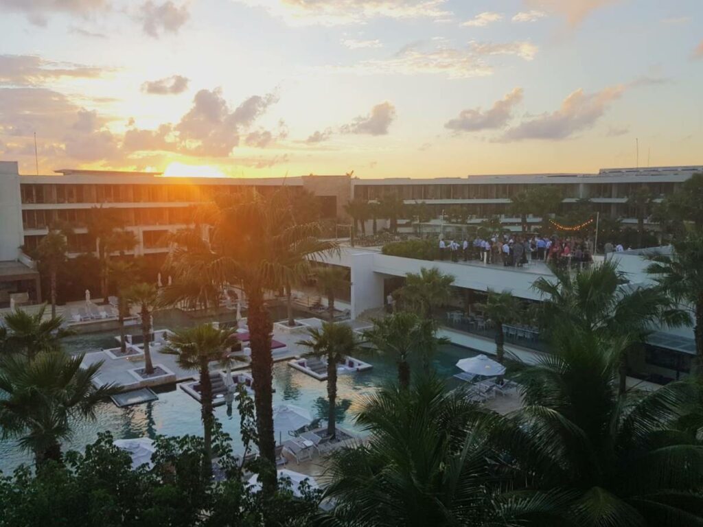 Sunset view of the resort and pools