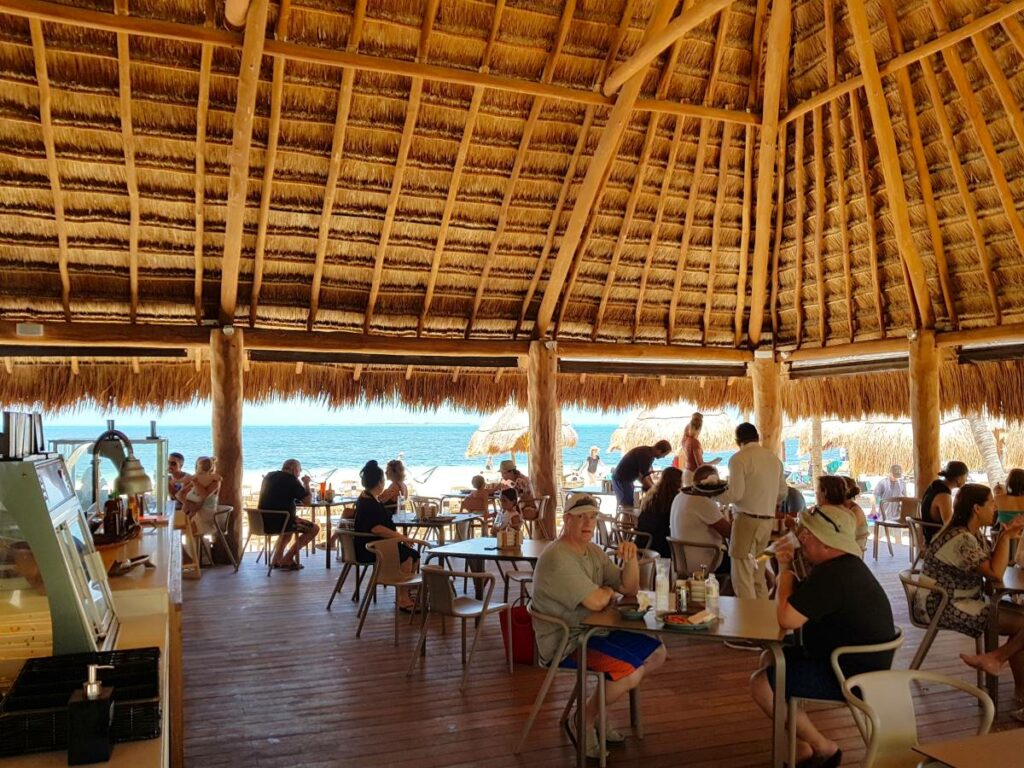 Ocean front restaurant with palapa roof and open kitchen