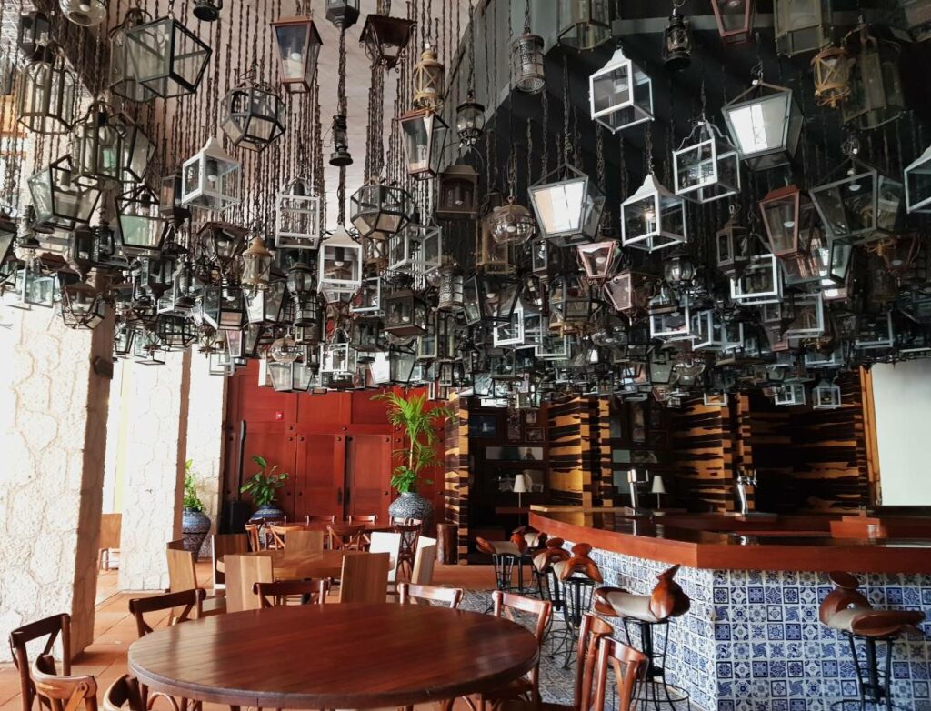 Mexican style restaurant with lots of hanging lanterns and wooden furniture