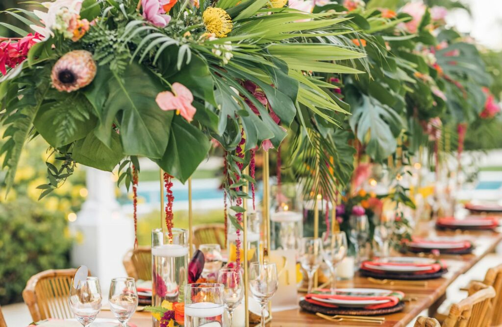 Wedding table with tropical decor and wooden furniture