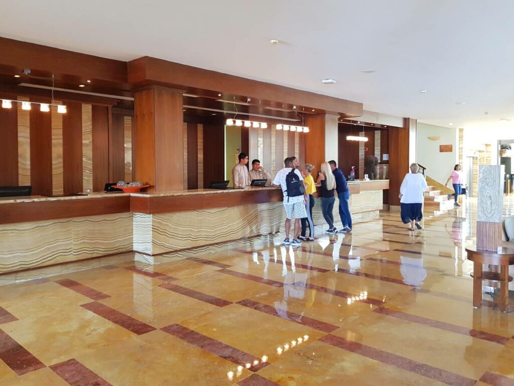 Hotel lobby with wooden and marble furniture