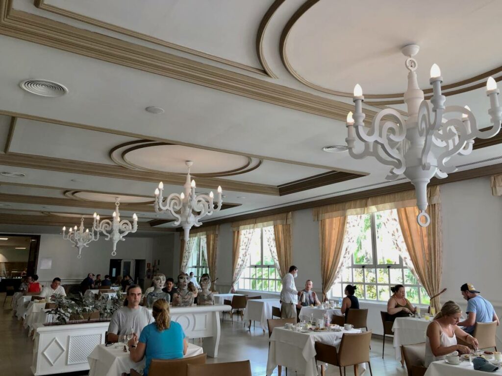 Elegant restaurant with white chandeliers and light tones