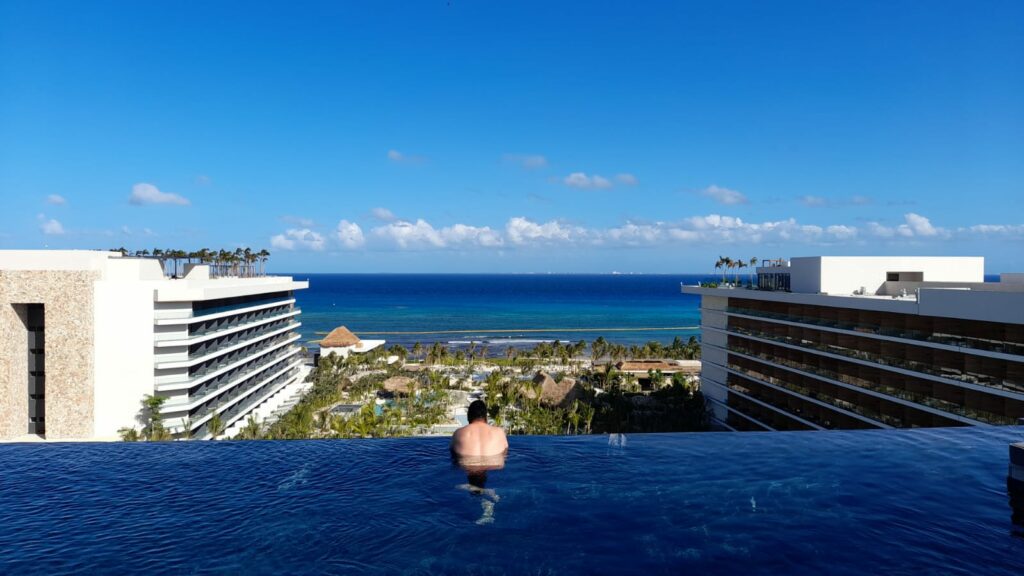 Rooftop infinity pool with panoramic views of the ocean