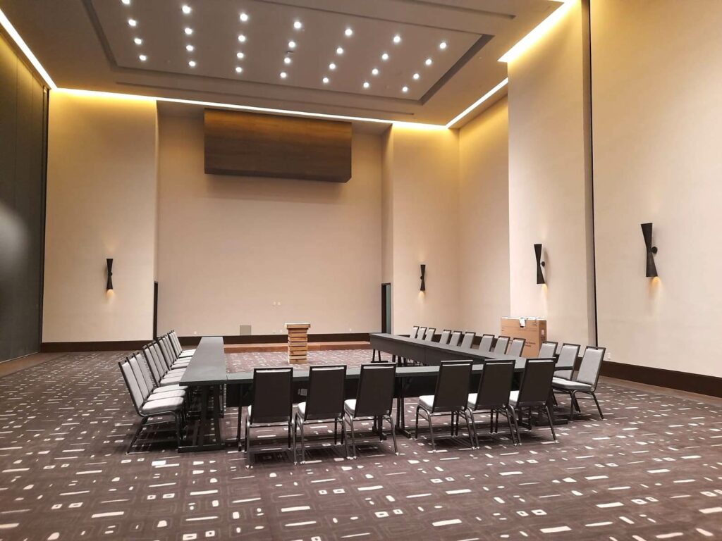 Hotel meeting room with tables and chairs