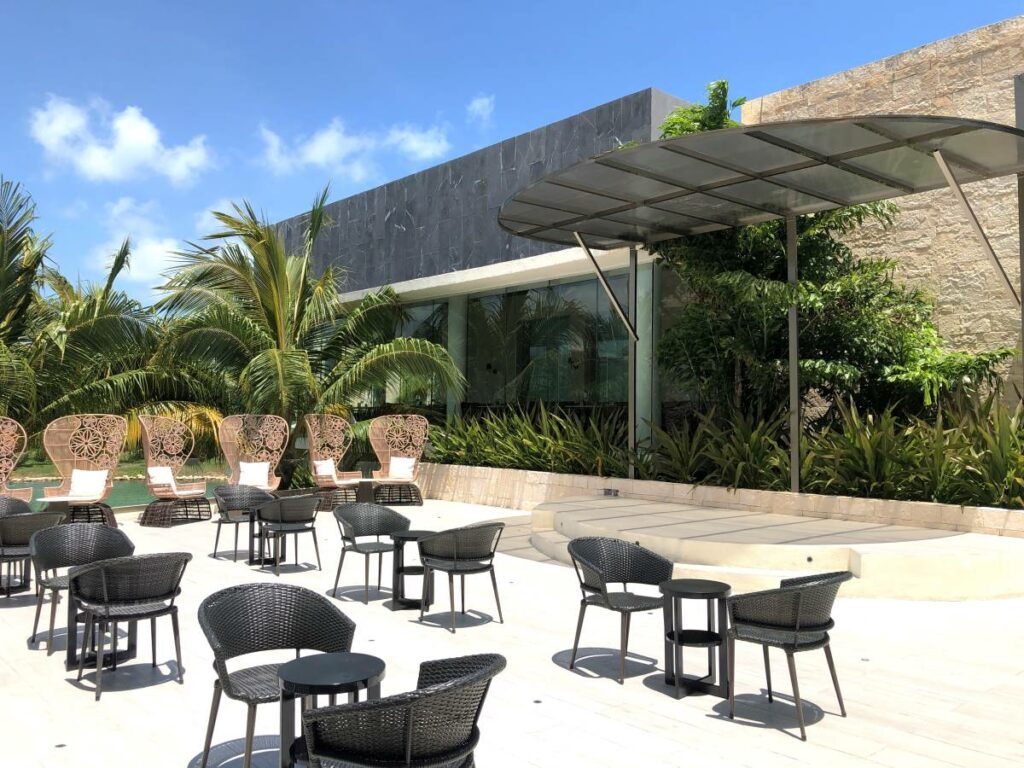 Outdoor terrace ideal for events with wooden furniture at trs costa mujeres weddings resort