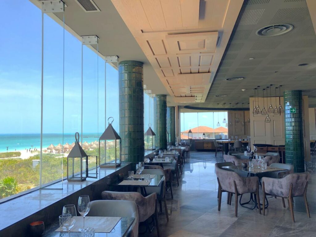 Steak restaurant with big windows overlooking the ocean