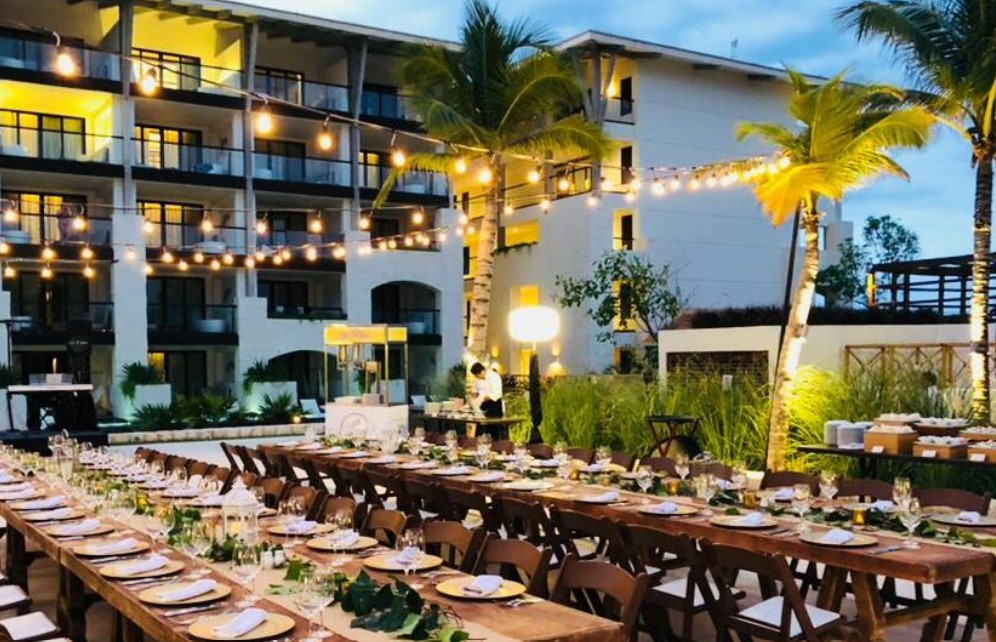 Wedding set up at a resort terrace with long tables and bistro lights