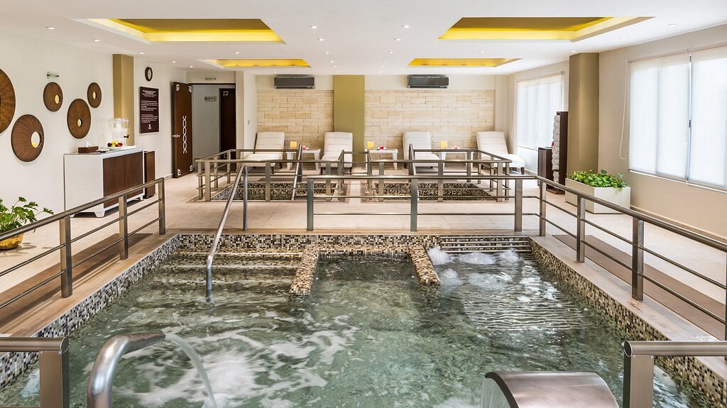Hotel spa with hydrotherapy areas and loungers