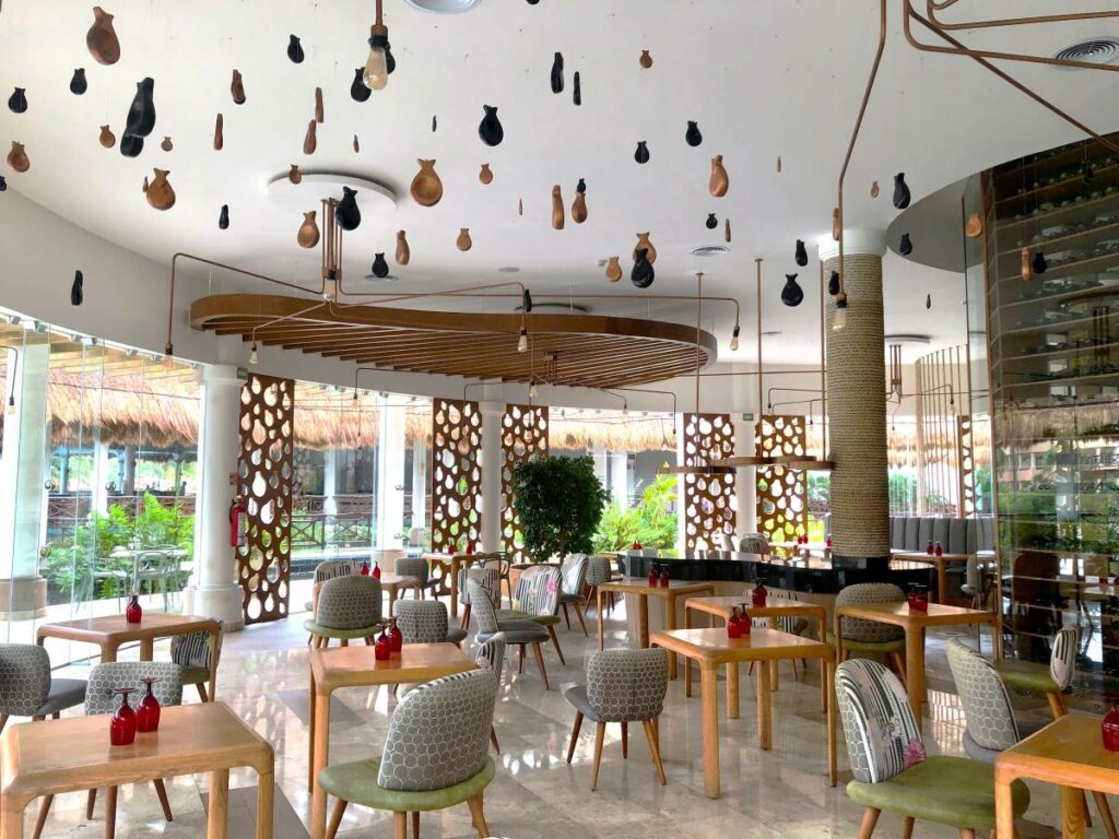 Trendy and modern spanish restaurant with fish and hanging lanterns and wooden furniture