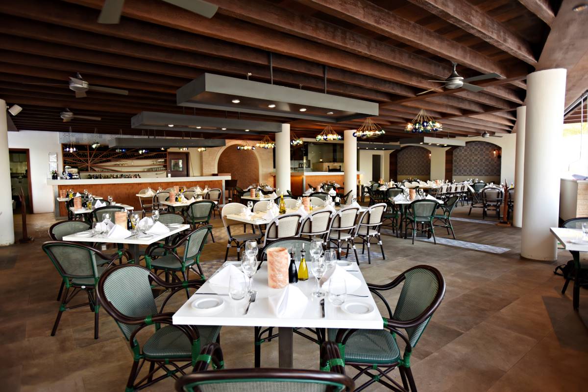 Resort italian restaurant with wooden furniture and chandeliers