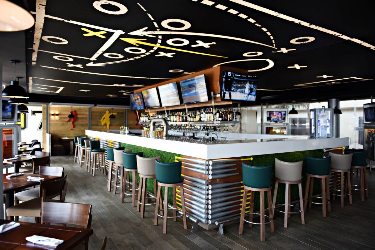 Sports bar with with screens and high chairs