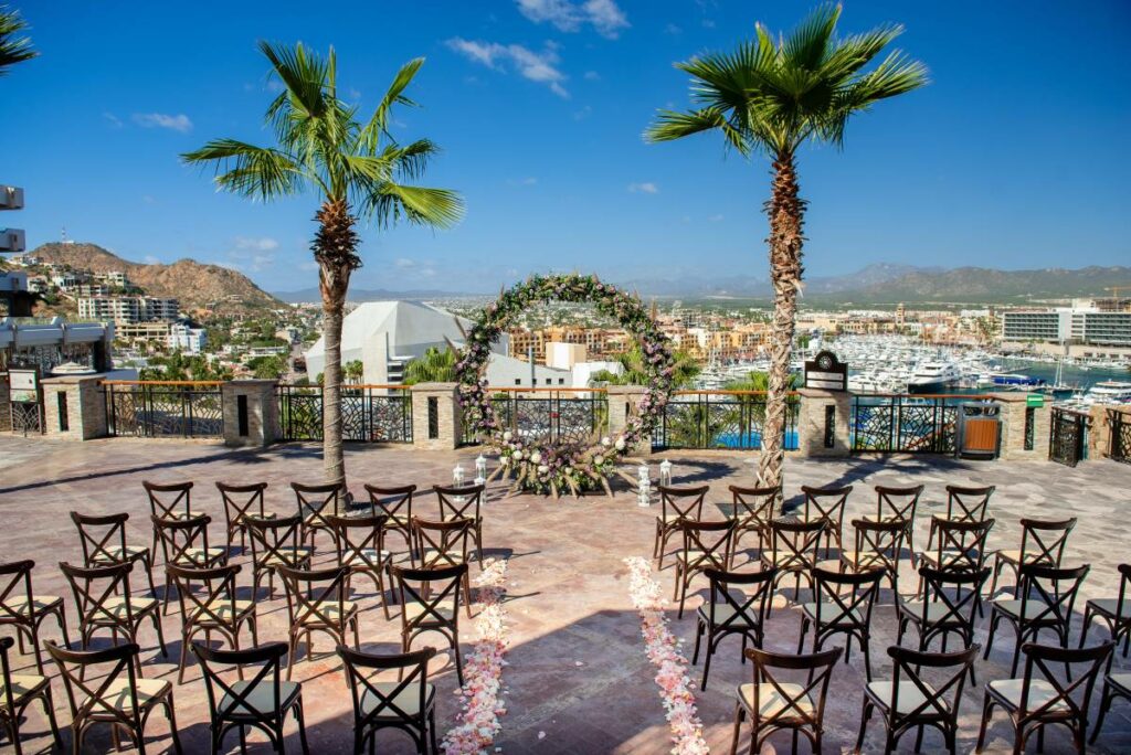 Wedding ceremony setting at a rooftop terrace with a circle of flowers