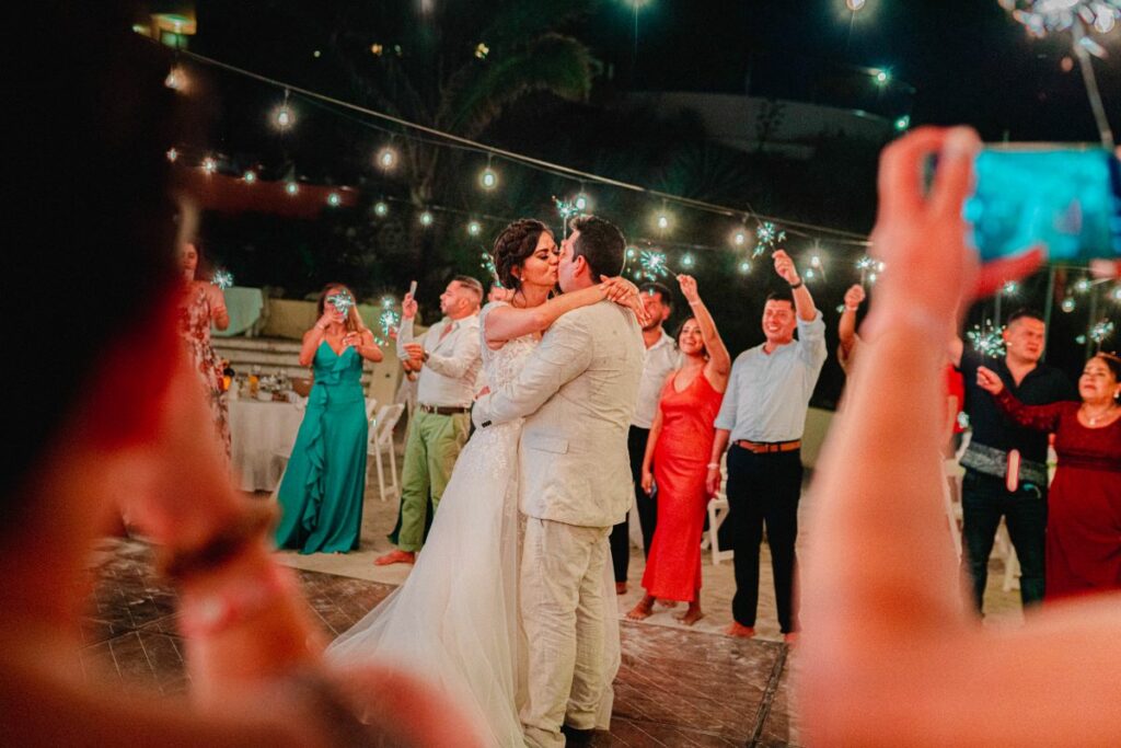 just married couple first dance with guests around with sparklers