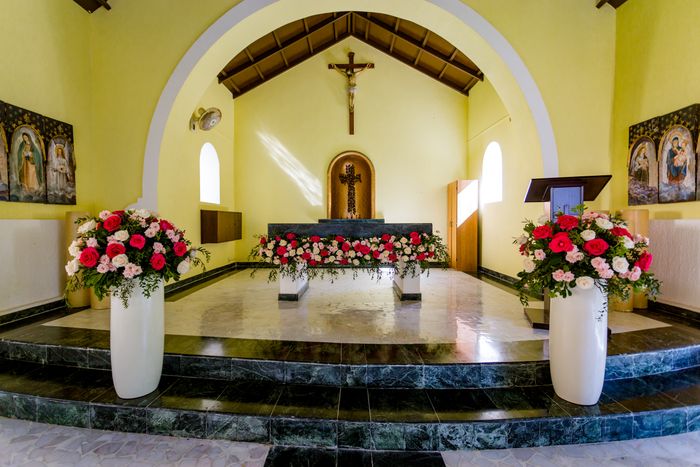 catholic wedding chapel with flowers and catholic images