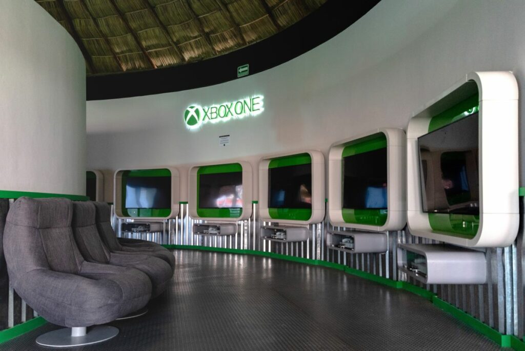 xbox video game room with screens and seats