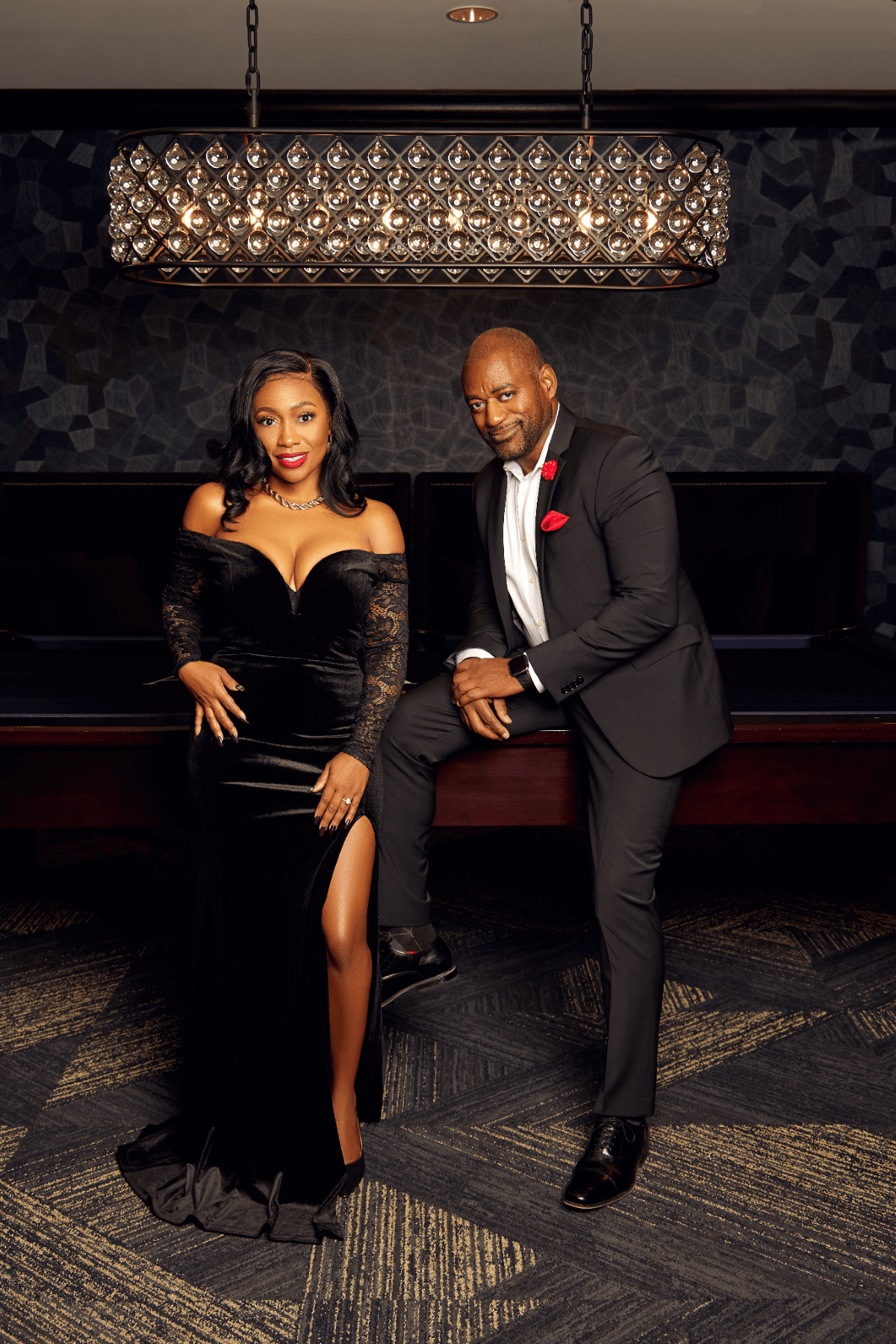 African american couple elegantly dressed in a living room with a piano