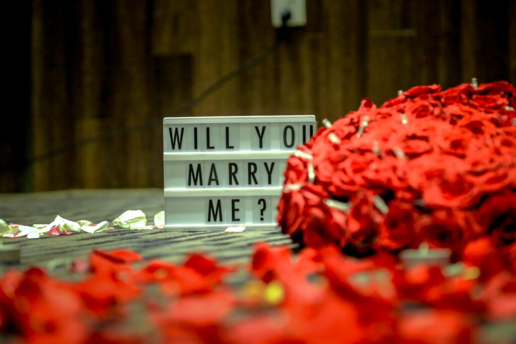 will you marry my sign with lots of red roses