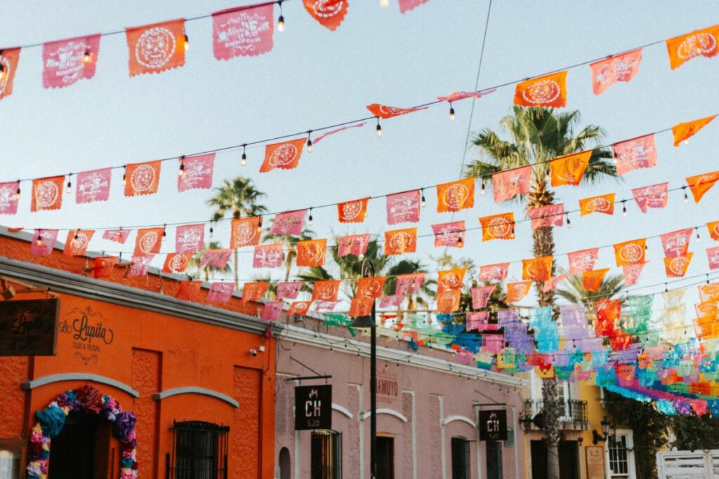 A colorful colonial mexican town with hanging flags