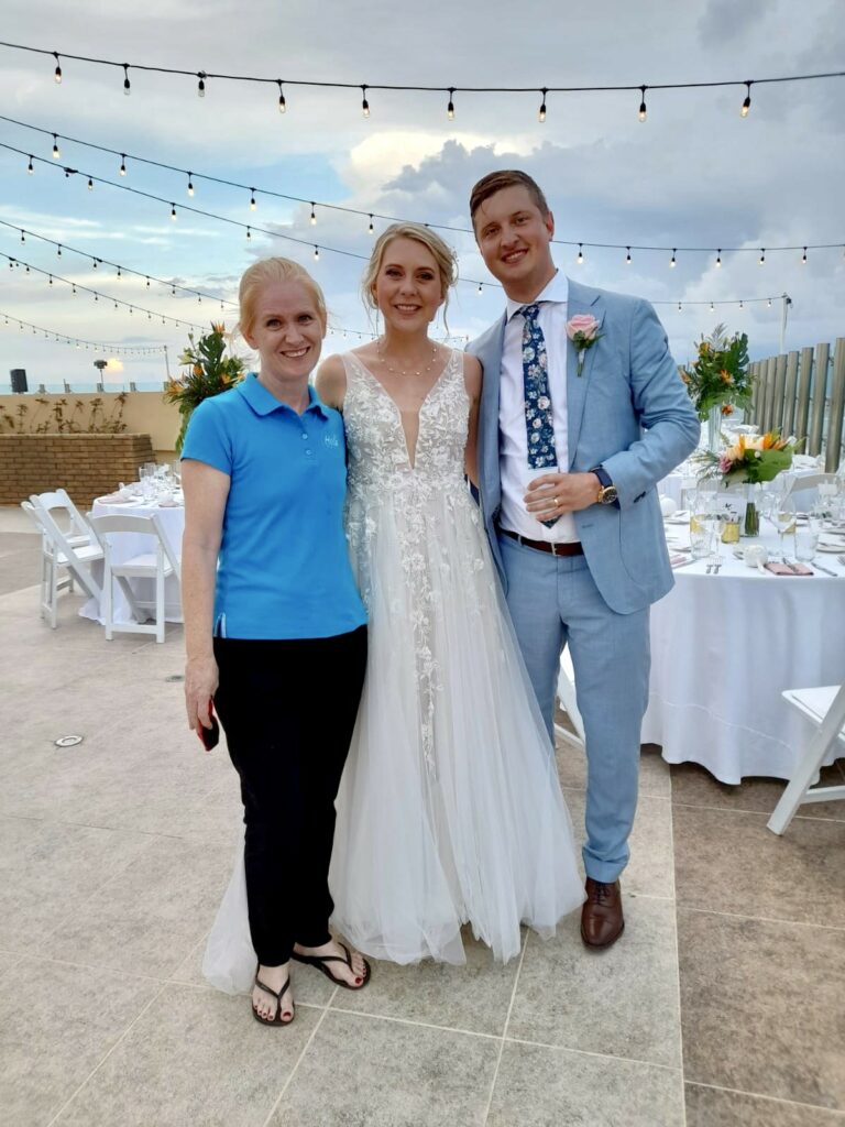 Lisa Wright with a just married couple