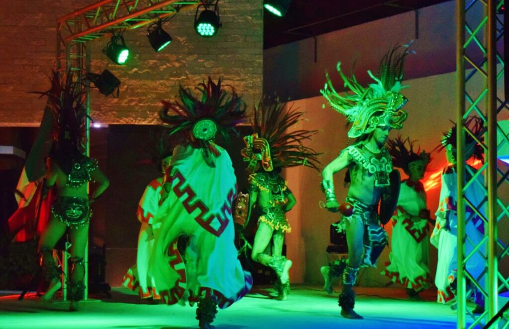 mayan show with dancers in traditional costumes