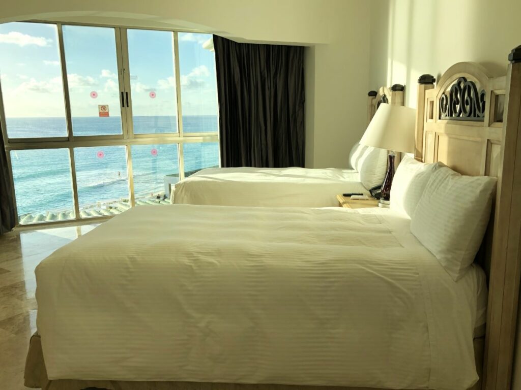 hotel room with two double beds and ocean view