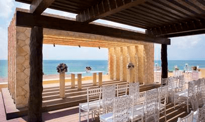 Destination wedding ceremony set-up at the Sky Wedding venue of the Royalton Riviera Cancun