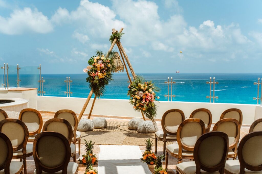 wedding ceremony set up at the private terrace of a beach resort in cancun