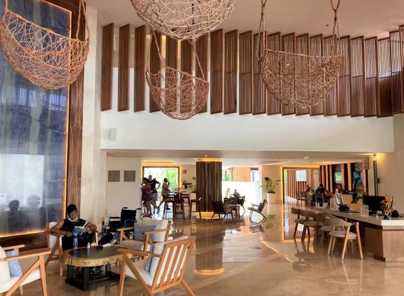 Lobby of a beach resort in mexico with modern decoration, wood and robe hanging lanterns