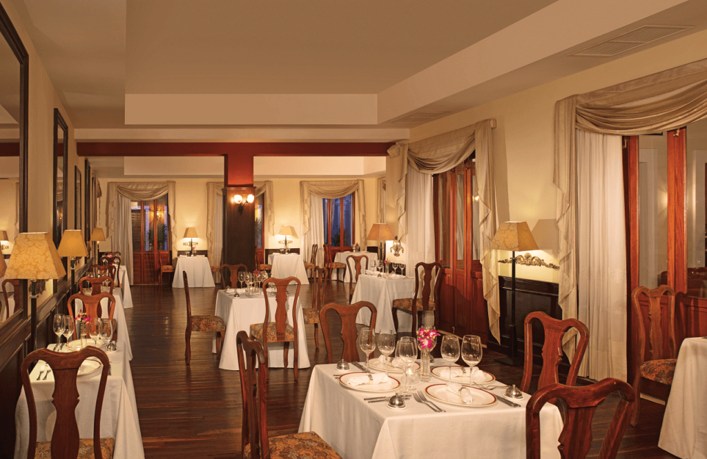 elegant french restaurant with classic furniture, long drapes and a romantic setting
