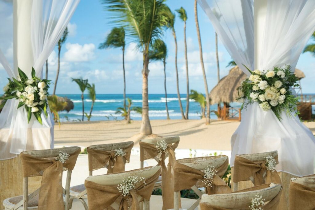 A beautiful wedding ceremony set up on a tropical beach in an all inclusive resort in punta cana